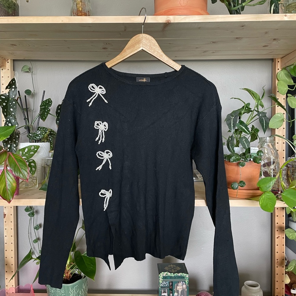 Elegant Black Sweater with Bow Accents